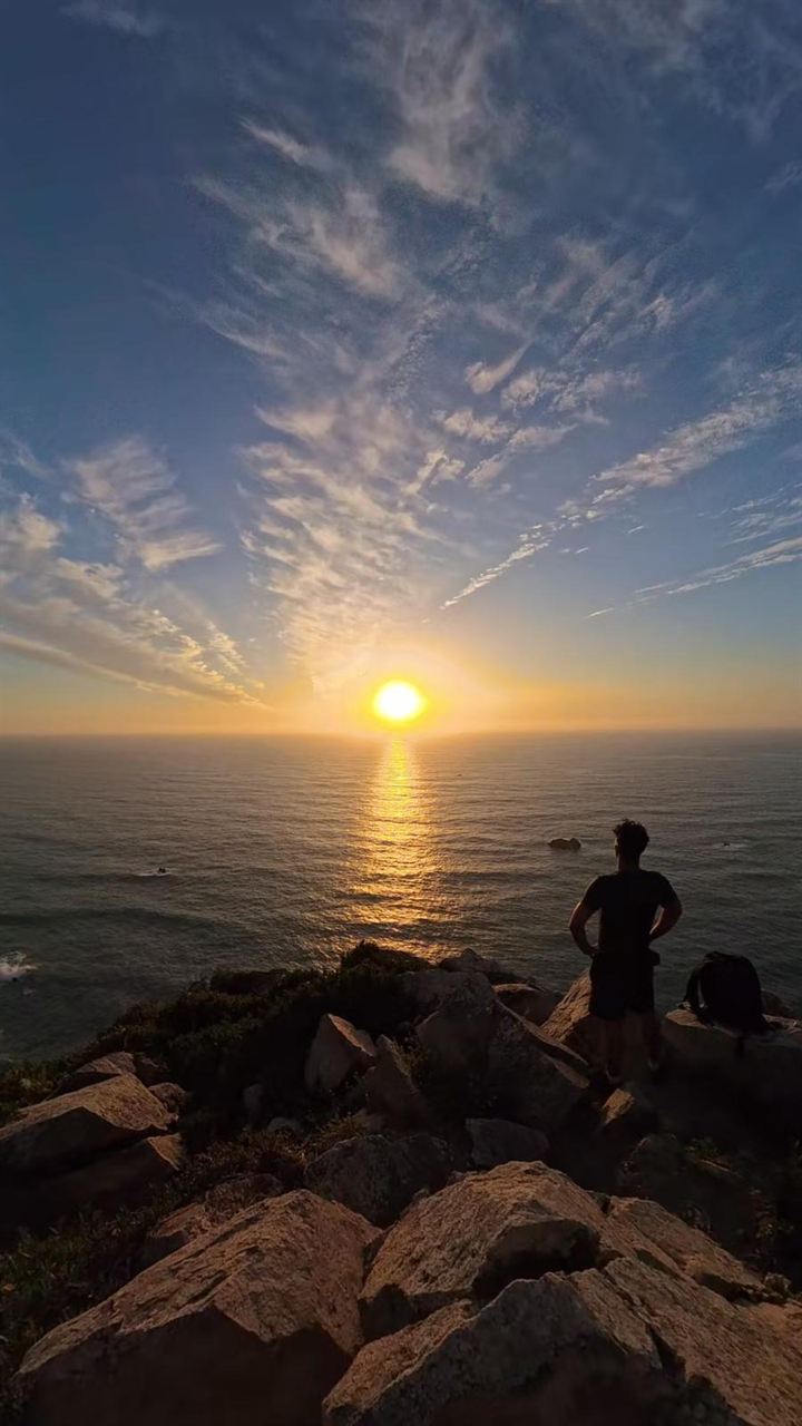 The Earn the Sunset crew together on the trail at golden hour